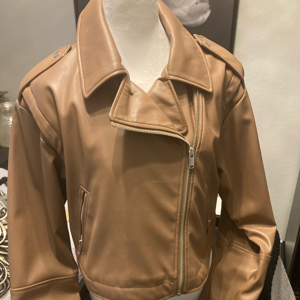 Faux leather camel colored super soft leather!
Looks and and feels like leather!